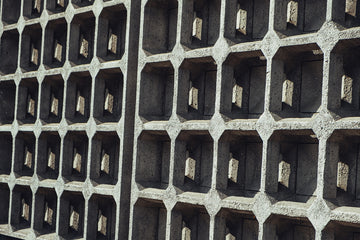 Geometric concrete wall with rectangular openings.